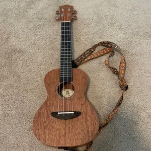 brand new Donner ukulele with picks strings and a tuner